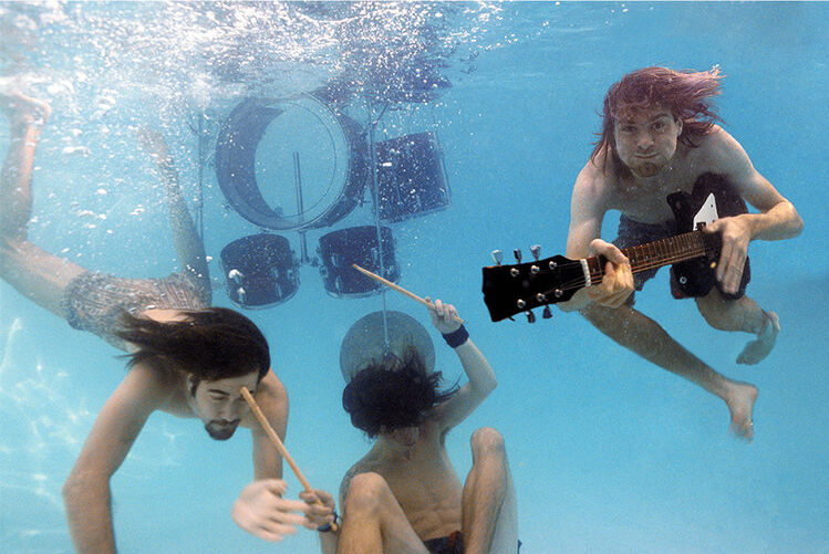 A group of people are playing instruments underwater